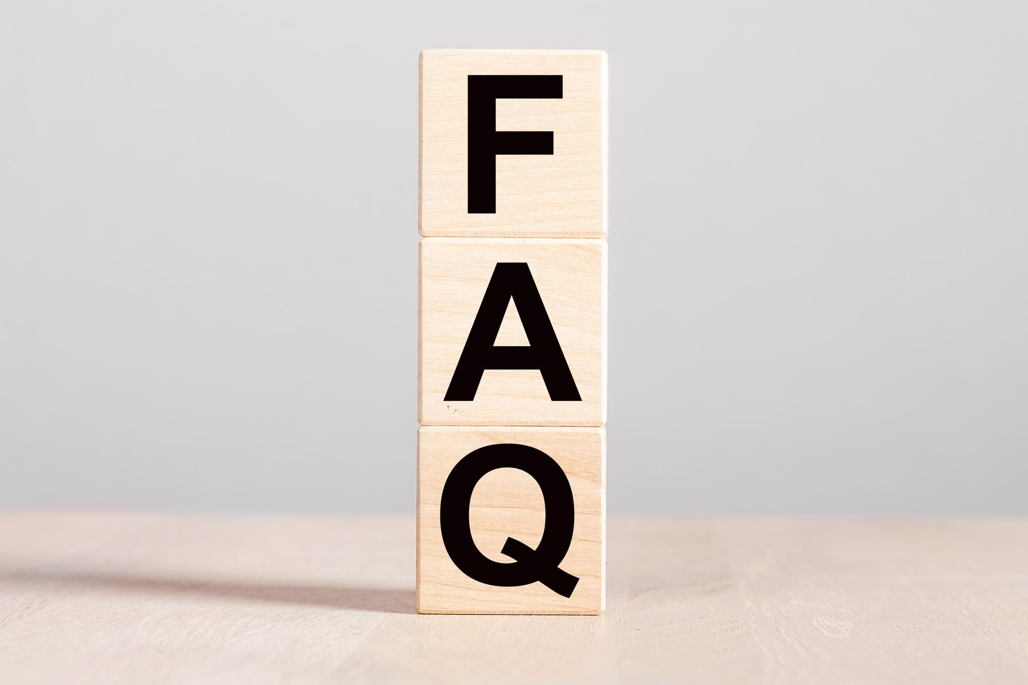 Wooden cubes displaying the text FAQ